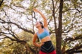 Sporty young black woman doing stretching at park in the morning,Fit girl warming up at outdoor,Happy and smiling Royalty Free Stock Photo