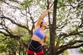 Sporty young black woman doing stretching at park in the morning,Fit girl warming up at outdoor,Happy and smiling Royalty Free Stock Photo