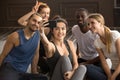 Multi-ethnic sporty people having fun taking group selfie in gym Royalty Free Stock Photo