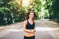 Young fitness girl running and listening music in the park Royalty Free Stock Photo