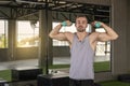 Sporty young man training with dumbbells with copy space. sport concept Royalty Free Stock Photo