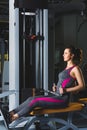 Sporty young woman doing exercise at the gym Royalty Free Stock Photo