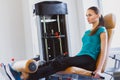 Sporty young woman doing exercise at the gym Royalty Free Stock Photo