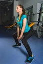 Sporty young woman doing exercise at the gym Royalty Free Stock Photo