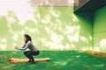 Sporty young woman doing squat exercise outdoors Royalty Free Stock Photo