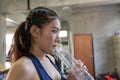 Sporty young woman drinking water at gym. Female drink water Royalty Free Stock Photo