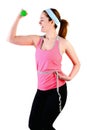 Sporty young woman with green dumbbell and measuring tape. Royalty Free Stock Photo