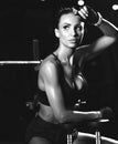 Sporty young woman working out with dumbbells weight in Gym. Diet and weight loss concept Royalty Free Stock Photo