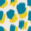 Blue and yellow spots with jagged edges form a leopard spotted seamless pattern for modern decorative pillows Royalty Free Stock Photo