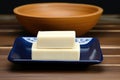 a spotless ceramic soap dish with a new bar of soap