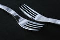 Spotless restaurant cutlery on black tablecloth Royalty Free Stock Photo