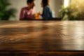 spotless wood table, blurred couple enjoying drinks behind