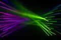 Spotlight Disco stage light beam in green and purple for abstract backdrop and background blur line party and clubbing concept Royalty Free Stock Photo