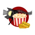 Spotlight, film strip, popcorn and tickets in a red circle. Vector illustration on a white background.