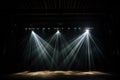 spotlight illuminating a stage in a dark theater