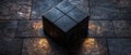 In a spotlight, a lone dark cube is positioned on a stage that is completely empty Royalty Free Stock Photo