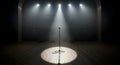 Spotlight on a lonely microphone on an empty theatre stage, ready for performance Royalty Free Stock Photo