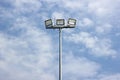 Spotlight pole, Power poles and sport light with blue sky and clouds background.