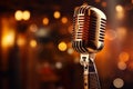 Spotlight on a retro microphone, stage with bokeh, music concept Royalty Free Stock Photo