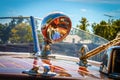 Spotlight on teak wooden race boat with reflections of wood and surroundings on glass and metal Royalty Free Stock Photo