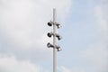 Spotlight tower against blue sky. street lamp. modern light pole. Royalty Free Stock Photo