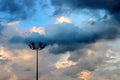 Spotlight tower against rainy cloud Royalty Free Stock Photo