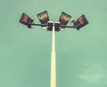 Spotlight tower with blue sky. The stadium light tower Royalty Free Stock Photo