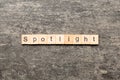 spotlight word written on wood block. spotlight text on table, concept