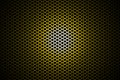 Spotlight on yellow metallic mesh