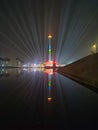 Spotlights and colorful lights decorate the Jakarta national monument (Monas) at night. Royalty Free Stock Photo