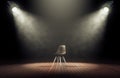 Spotlights illuminate empty stage with chair in dark background.