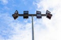 Spotlights on steel pole in stadium with blue sky background Royalty Free Stock Photo
