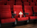 Spotlit red cinema chair with popcorn and soda. 3D illustration