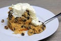 Spotted dick steam pudding with cream.