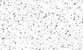 Spotted grunge white background with chaotic black spots, dots, litter, small scraps on a light background. Simple primitive Royalty Free Stock Photo