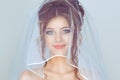 Spouse. Close up shot of elegant, brunette girl, woman, bride posing under veil closeup  light blue background with copy Royalty Free Stock Photo