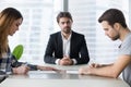 Spouses couple signing decree papers getting divorced in lawyers office