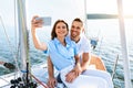 Spouses On Cruise Yacht Making Selfie Standing On Deck Outside