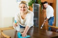 Spouses dusting and hoovering Royalty Free Stock Photo