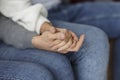 Spouses Holding Hands Supporting Each Other Sitting Indoor, Cropped Royalty Free Stock Photo