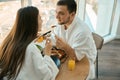 Spouses in love chat nicely over breakfast in cozy atmosphere