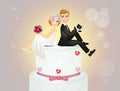 Spouses sitting on Wedding cake