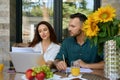 Spouses work with documents on the terrace