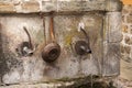 Spout of old stone fountain