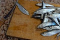 Sprat fish on a cutting board Royalty Free Stock Photo