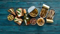 Sprats with oil in a jar. On a blue background. top view. Royalty Free Stock Photo