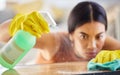 Spray bottle, cloth and woman cleaning table from bacteria, germs or dirt with disinfectant liquid. Housekeeping Royalty Free Stock Photo