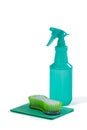 Spray bottle and scouring pad on white background Royalty Free Stock Photo
