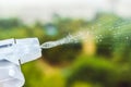 Spray bottle spraying water into the air Royalty Free Stock Photo