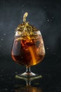 Spray in cognac glasss Royalty Free Stock Photo